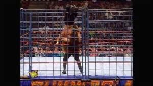 Here's a suplex into a tree of woe against the cage.